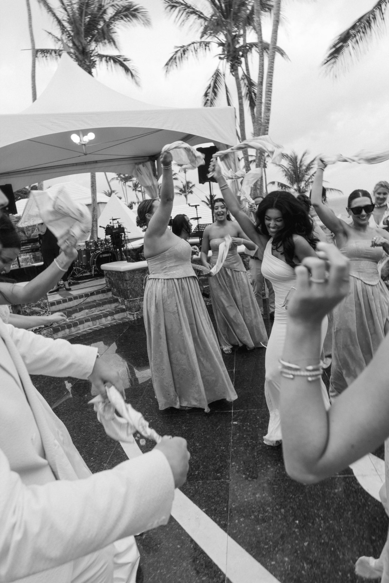 Black and white slow shutter of napkins swinging on wedding dance floor