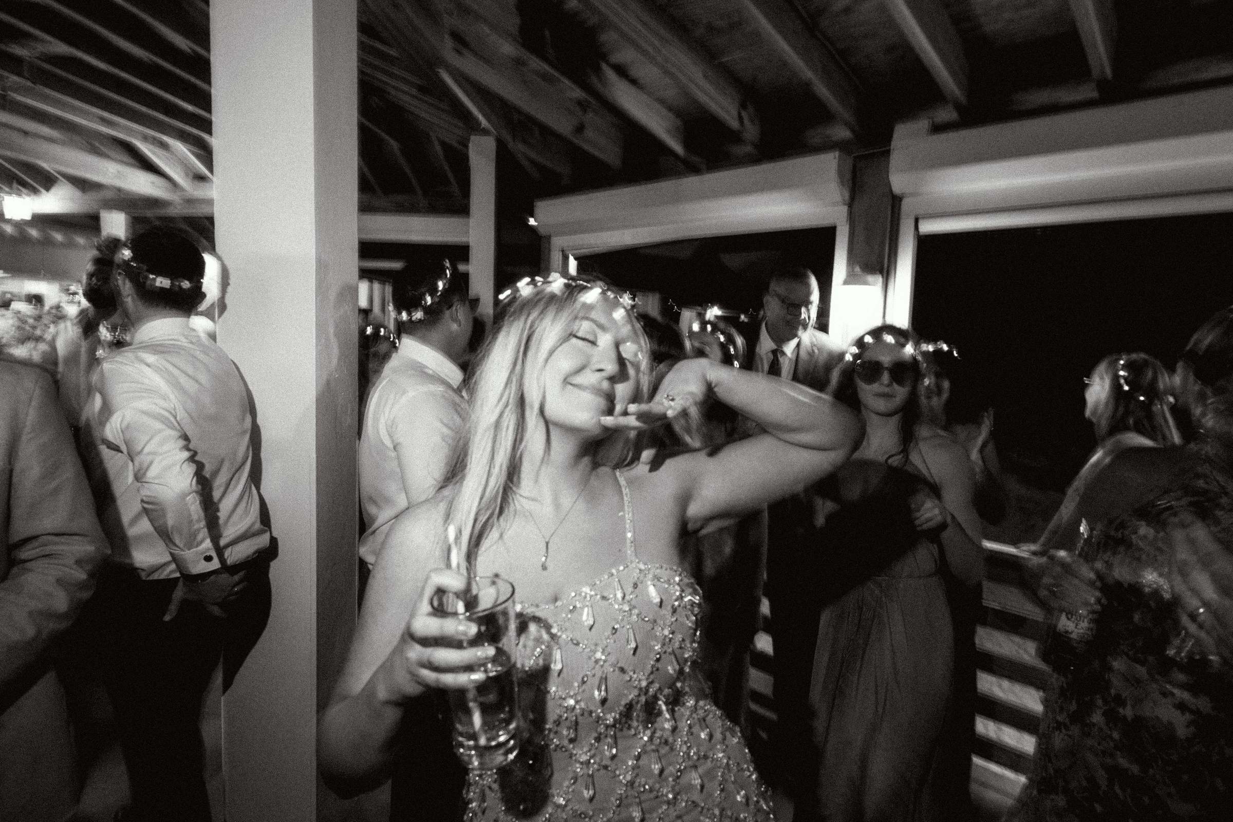 Black and white photograph of bride dancing late night at Bermuda wedding reception