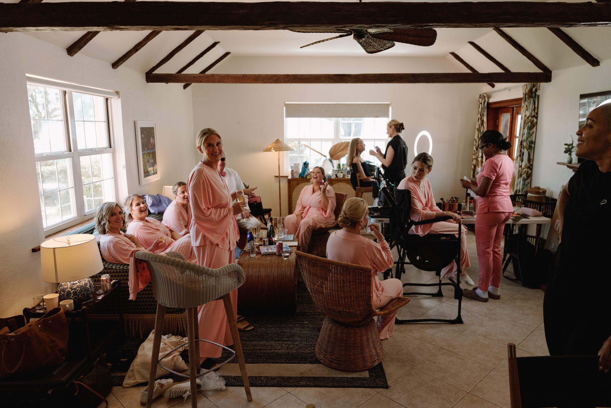 Wide getting ready room with bridesmaids in pink pyjamas at a Bermuda beach cottage