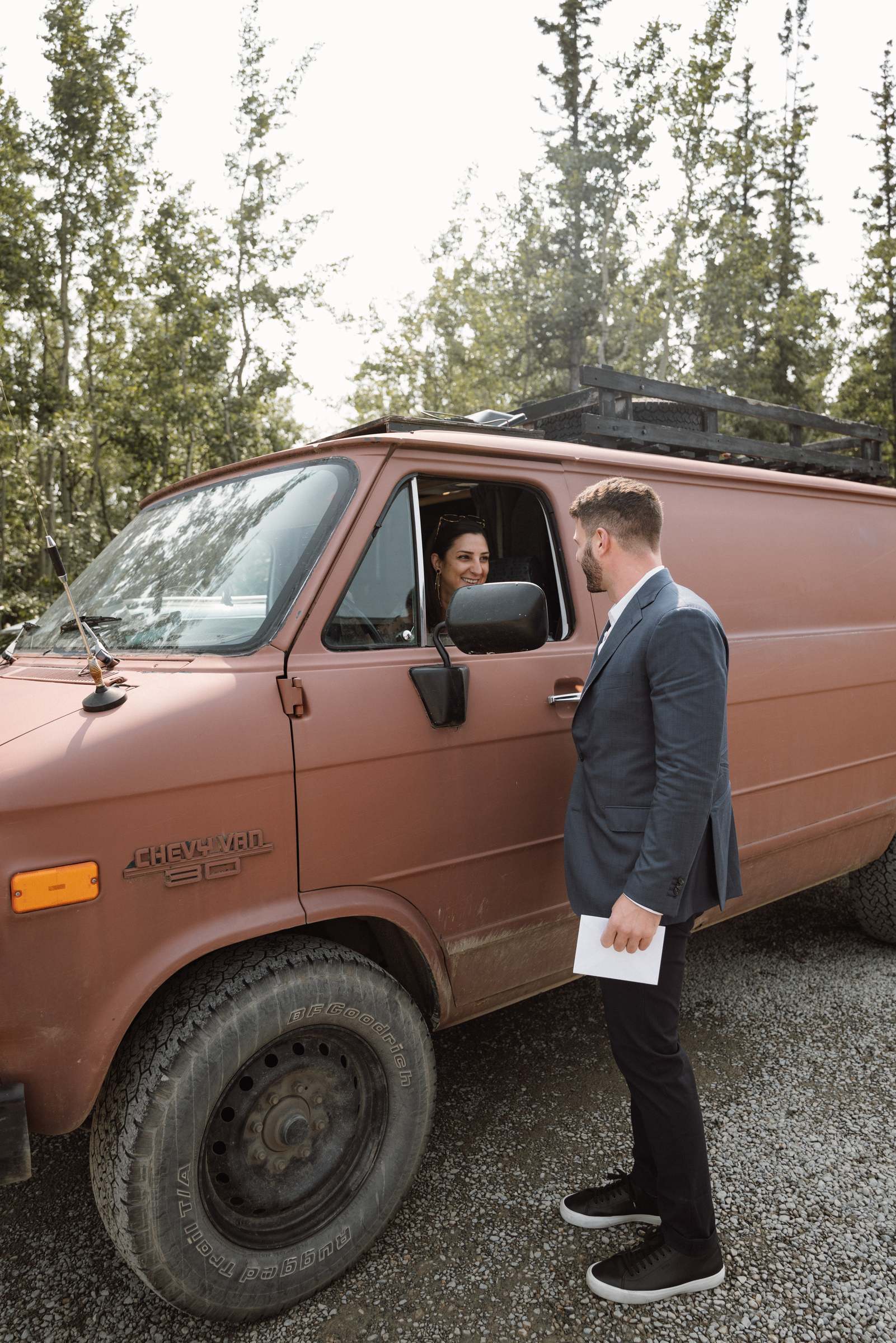 Bride and groom's first look beside the vintage van before the ceremony