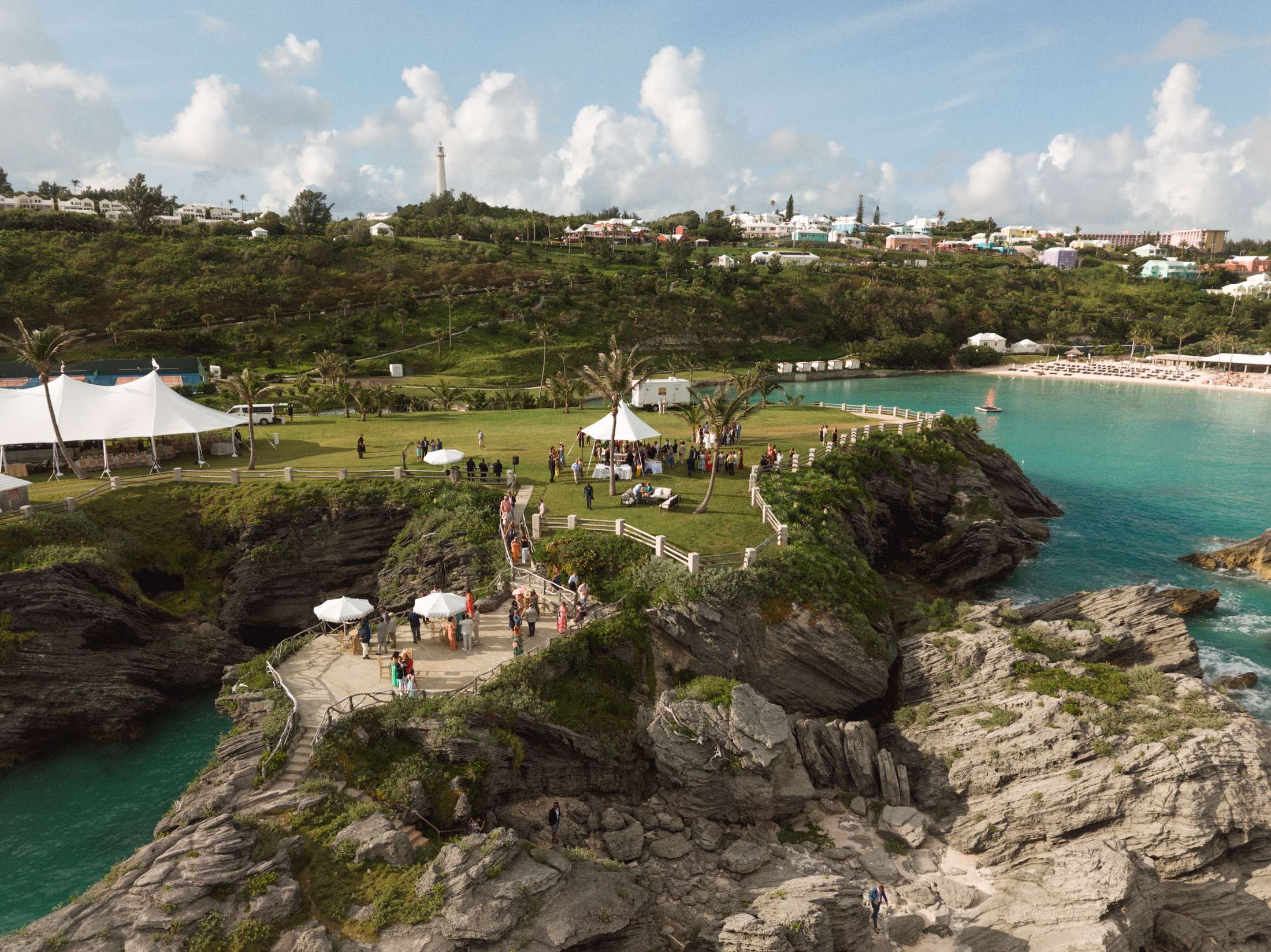 Aerial view of a Bermuda cove with the reception tent above the beach