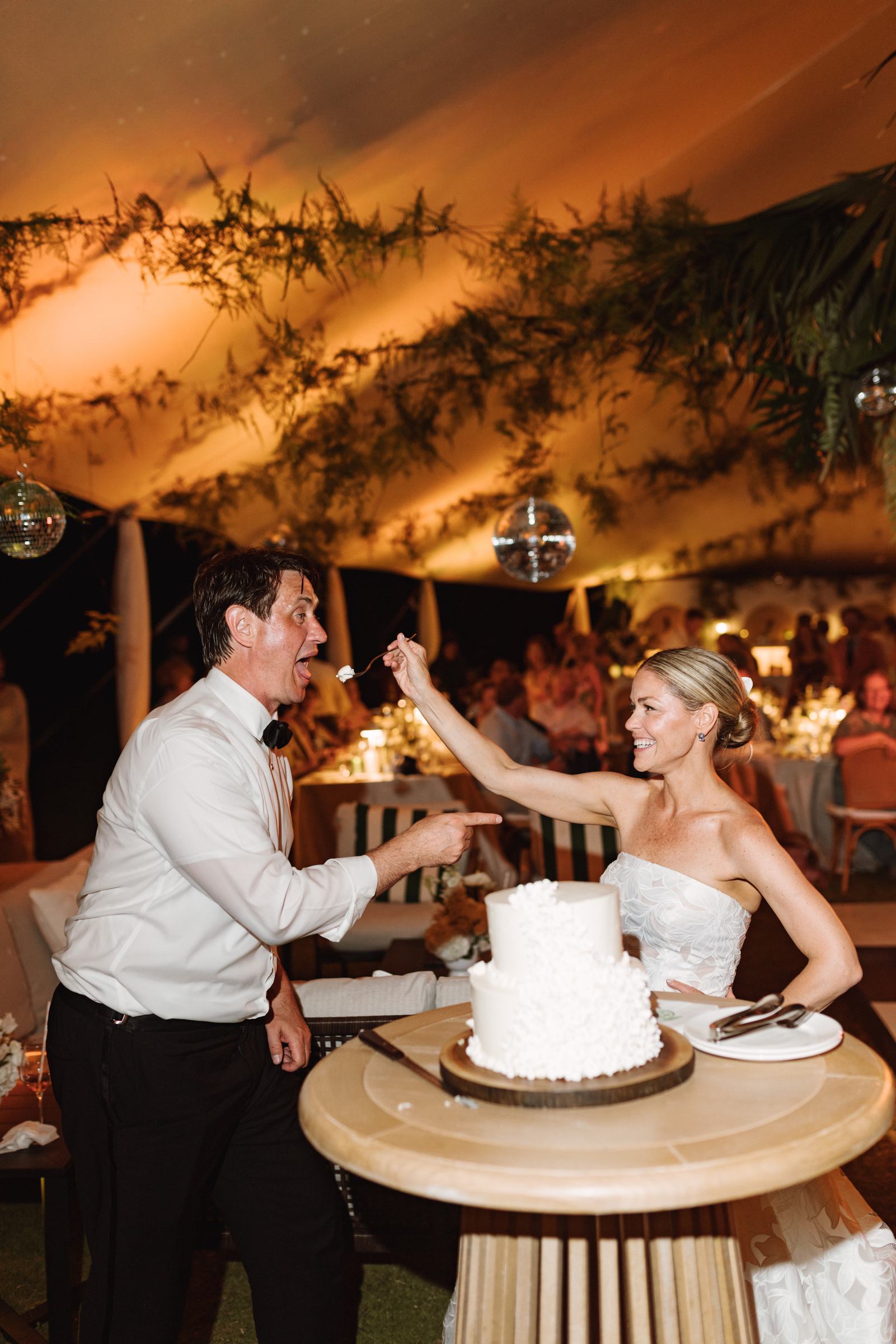 Bride and groom cutting their wedding cake at a Bermuda reception