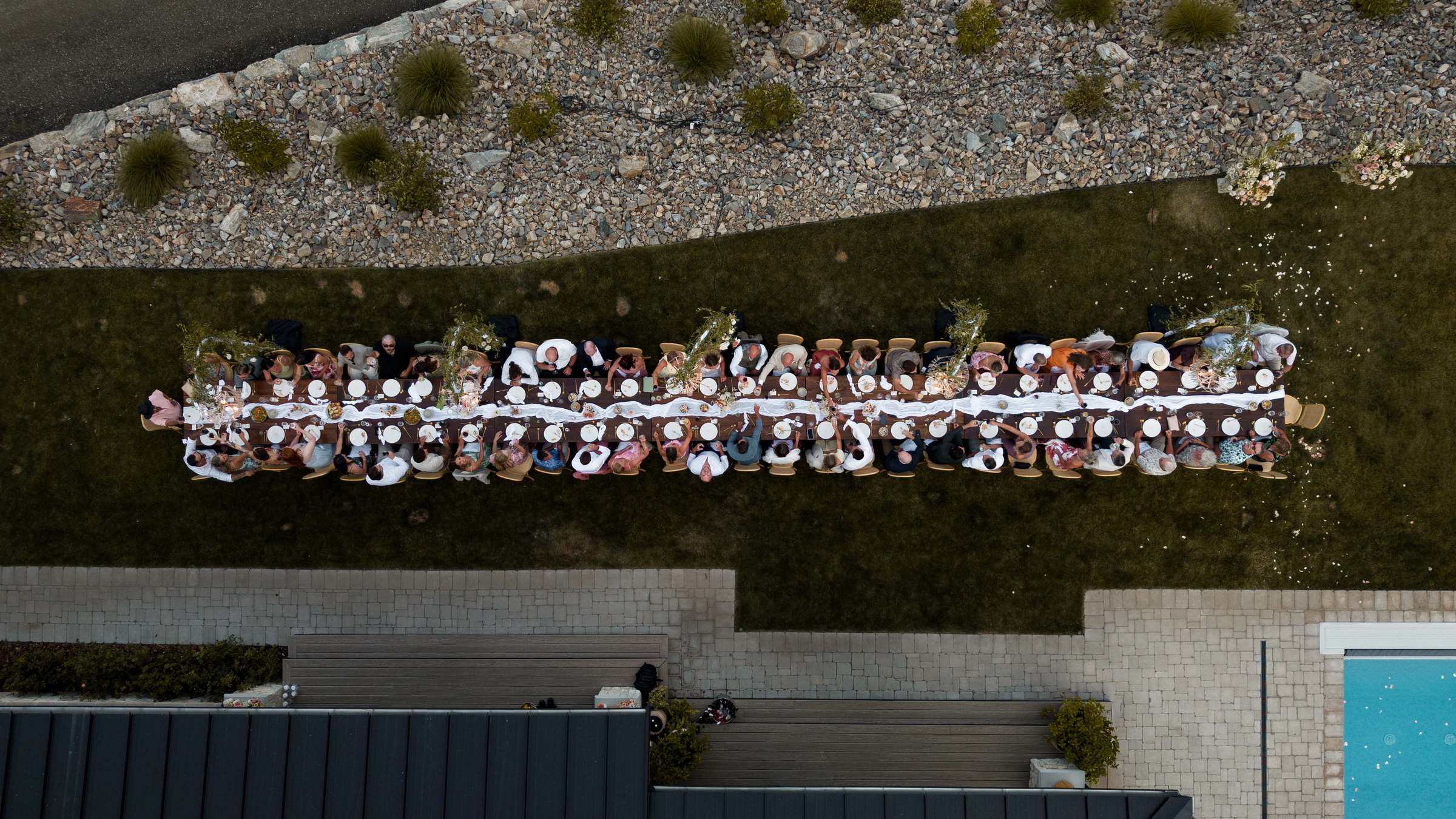Aerial view of the long reception table with all the guests seated