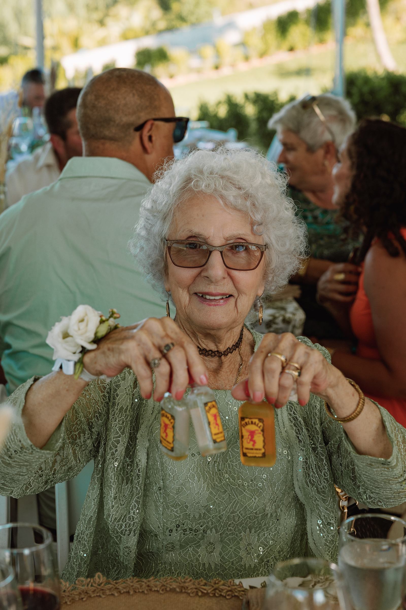 Grandmother smiling at her place at the wedding reception table