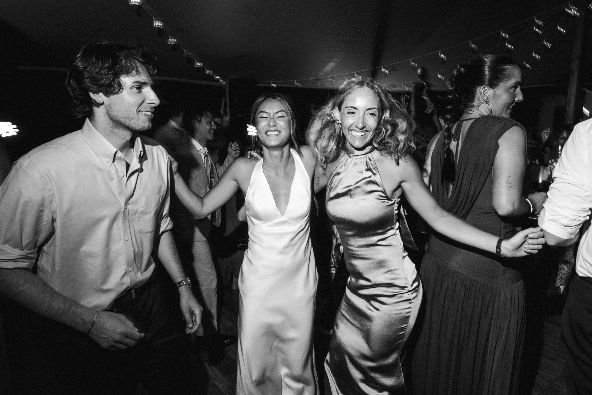 Black and white photograph of the couple dancing in the crowd