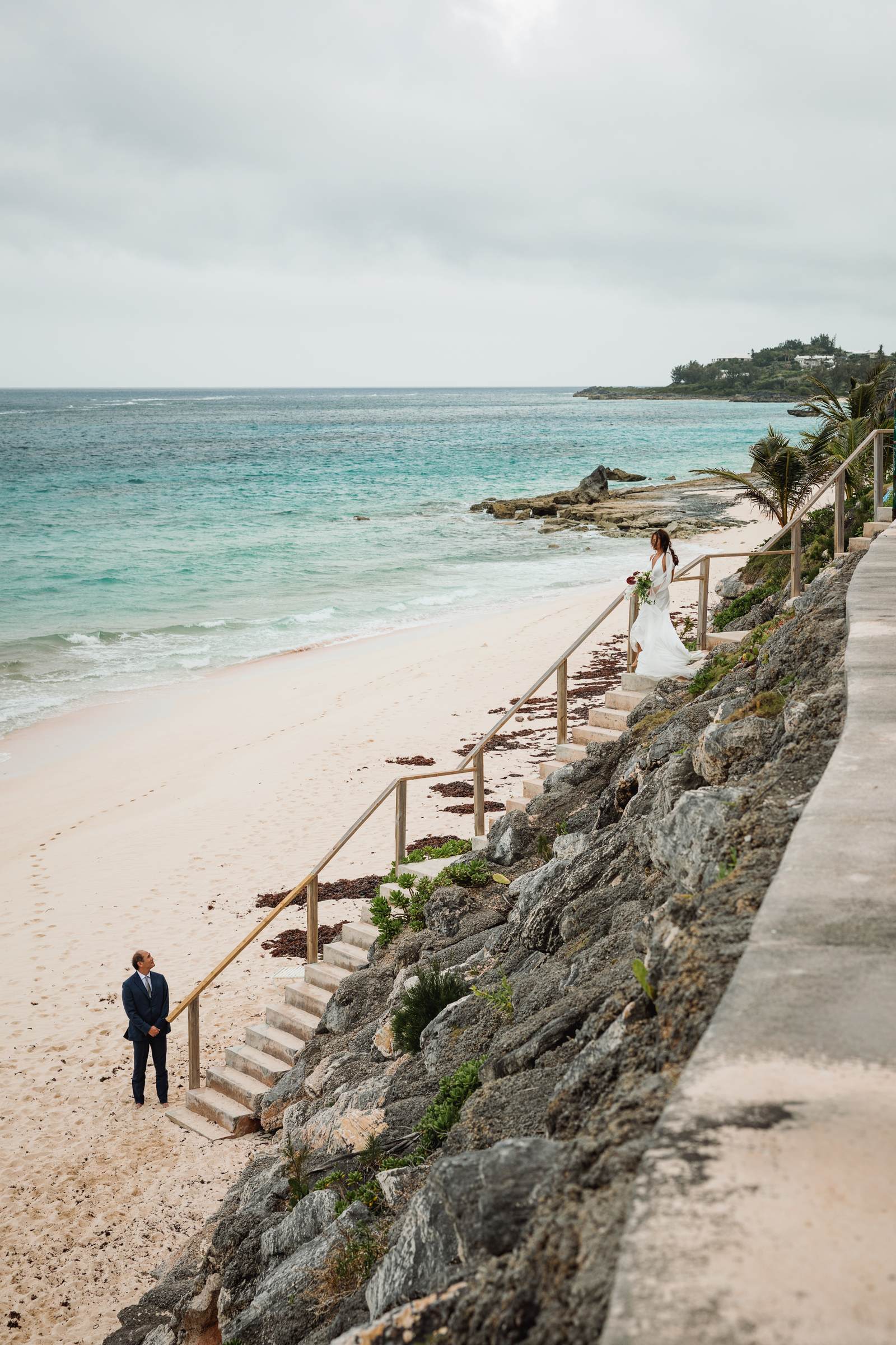 Cliff path leading down to the Bermuda beach with a lone figure below
