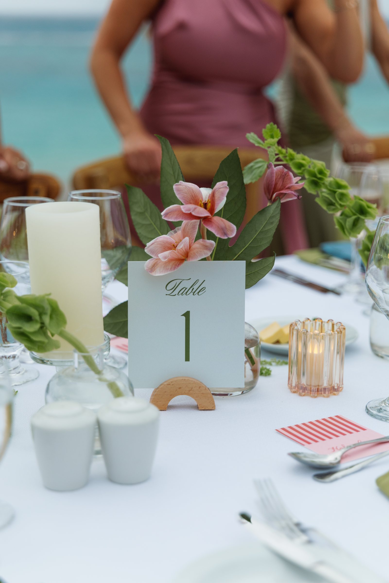 Table number with a lily and candles at a Bermuda wedding reception
