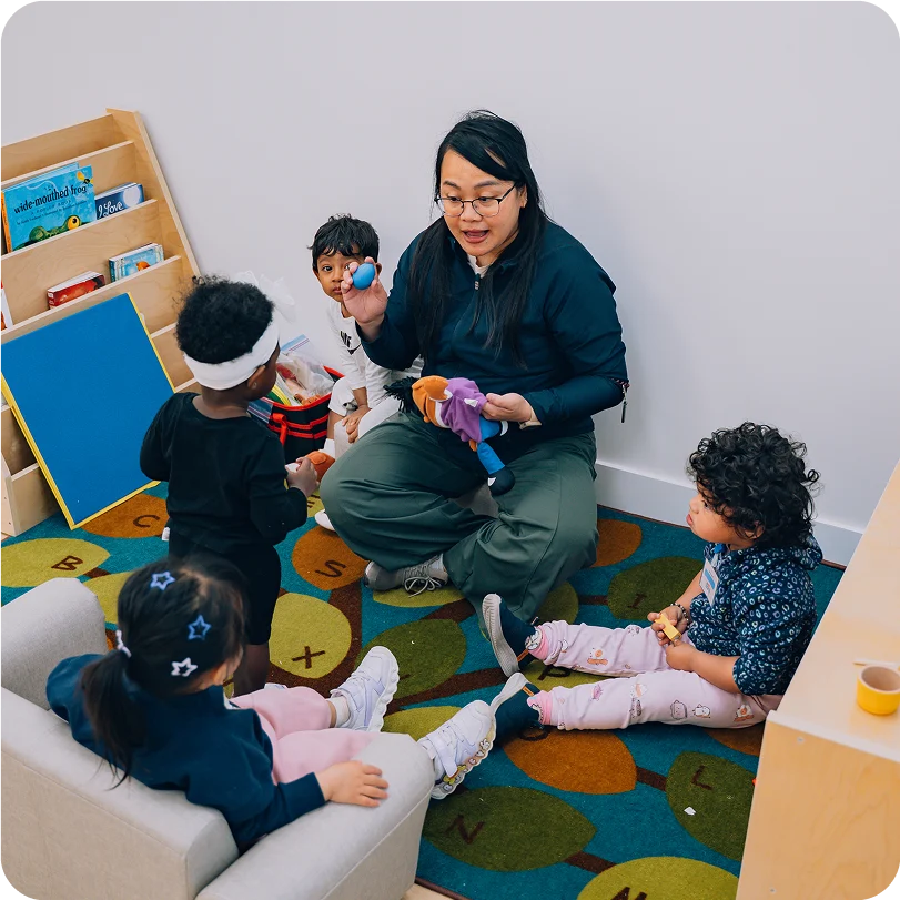 A woman playing with kids