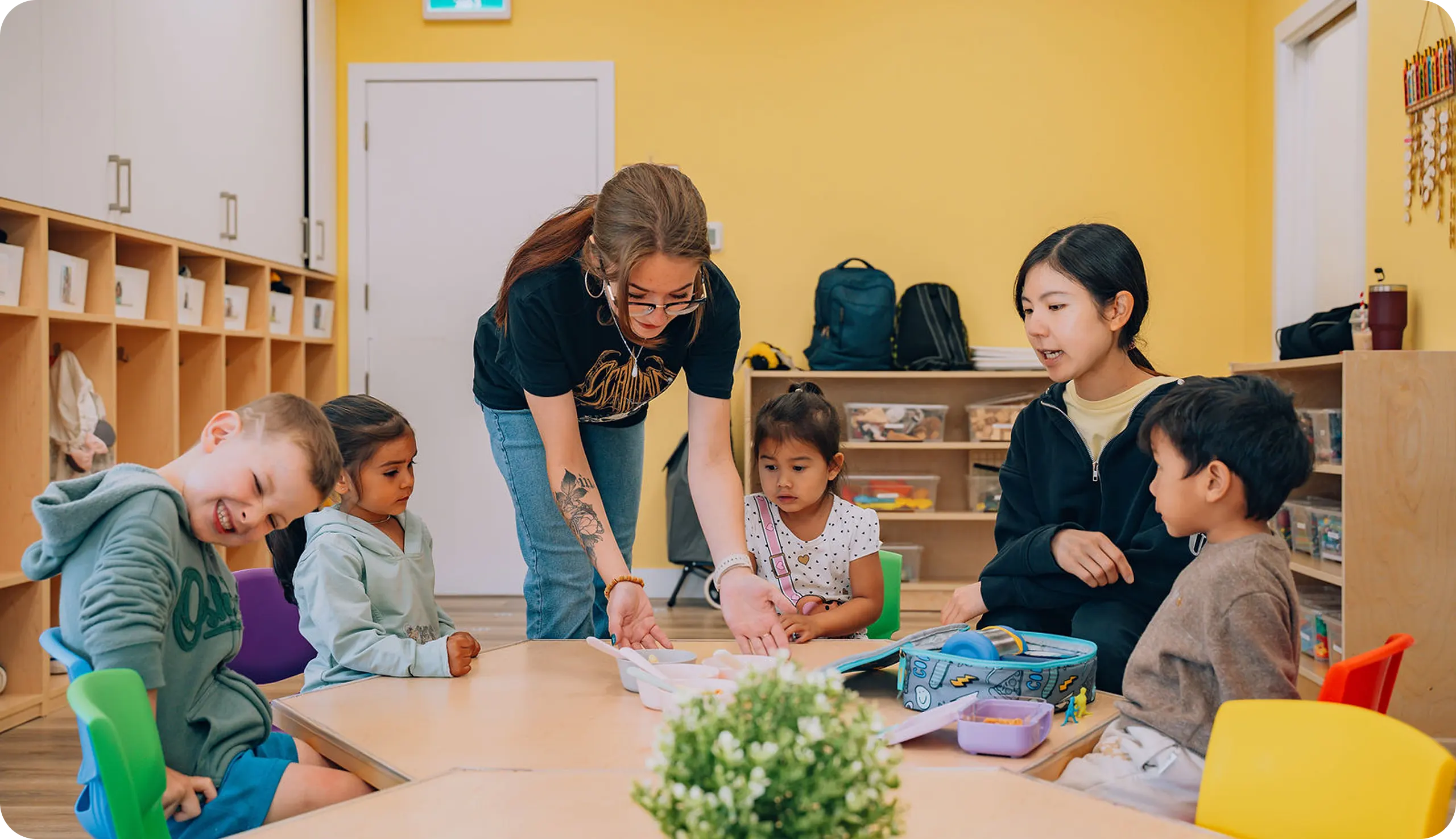 A woman is playing with kids