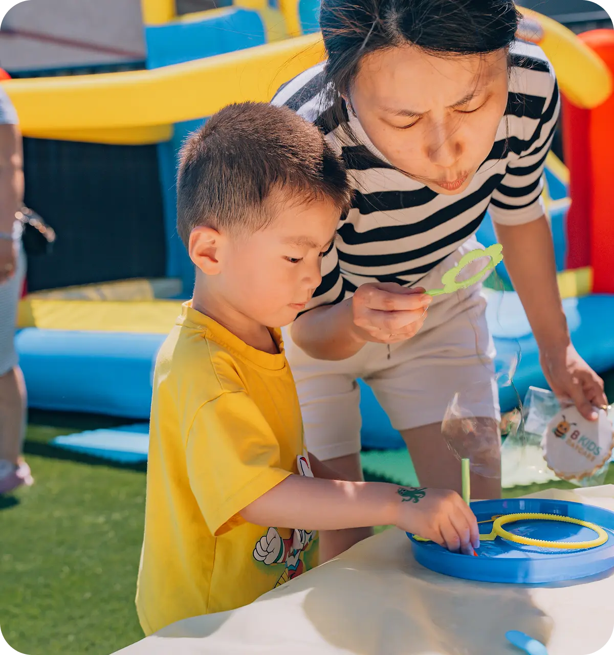 Educator supervising outdoor play at B Kids Daycare—licensed, nut-free childcare in Surrey & Langley