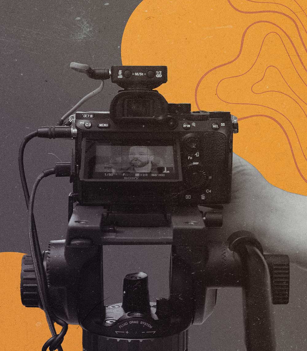 Hand holding a DLSR camera