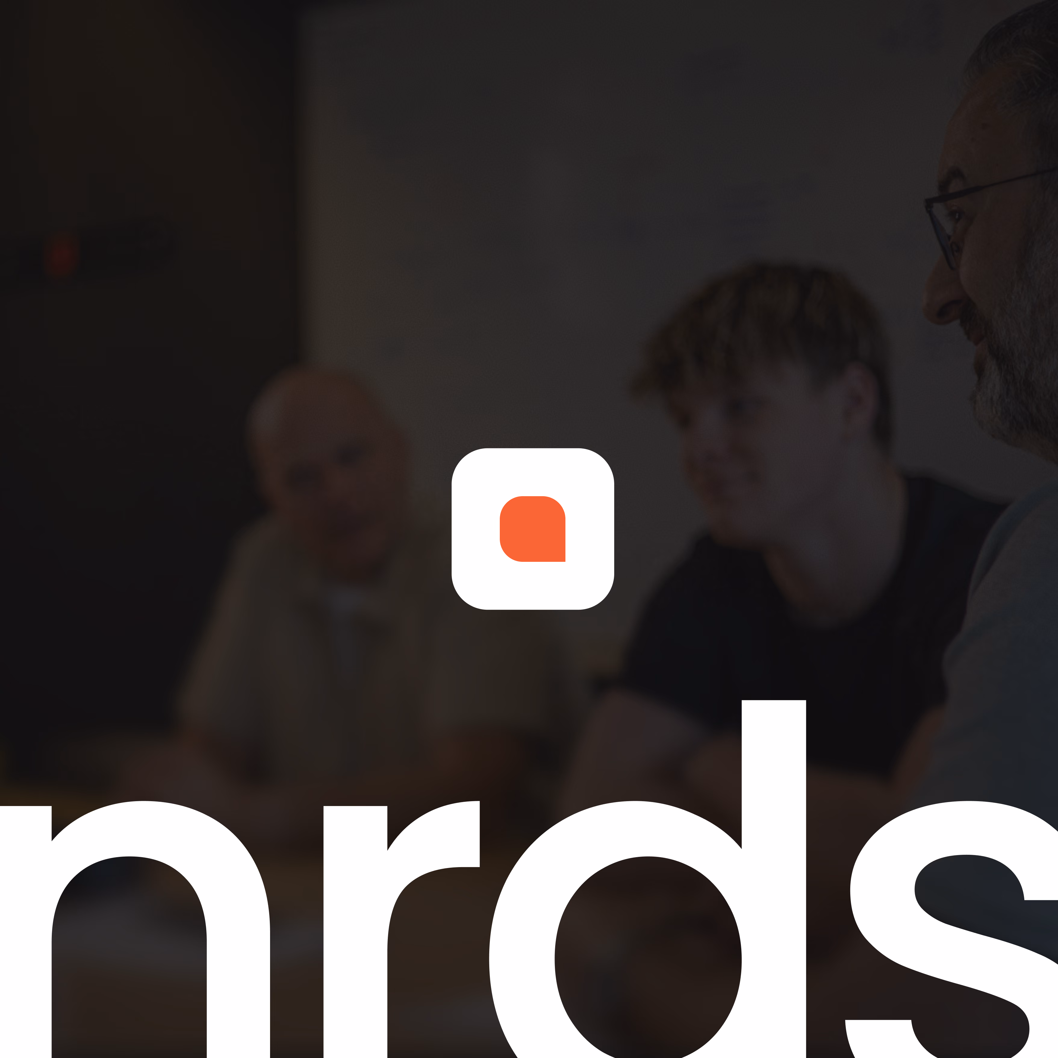 Blurry group of three people in discussion behind partial white text and a white and orange app icon.
