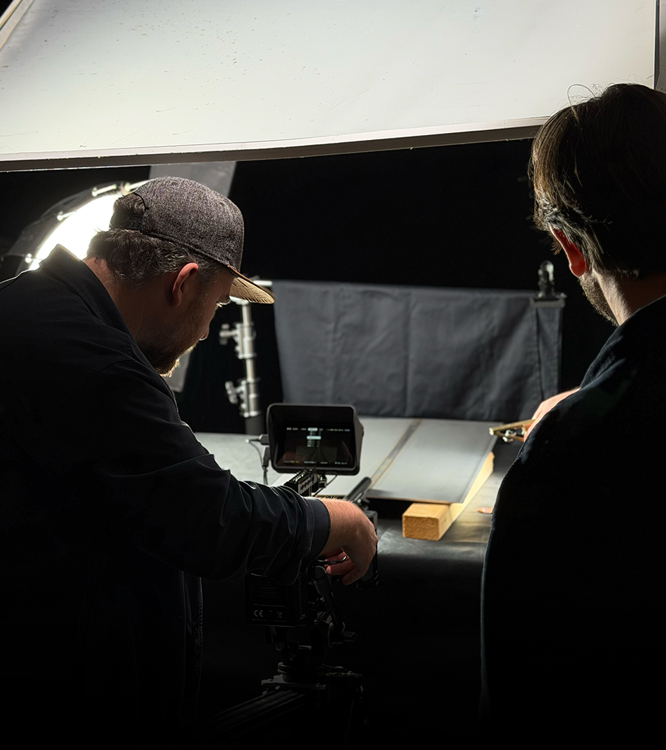 Photographer setting up a camera during a Digitalmakers product shoot