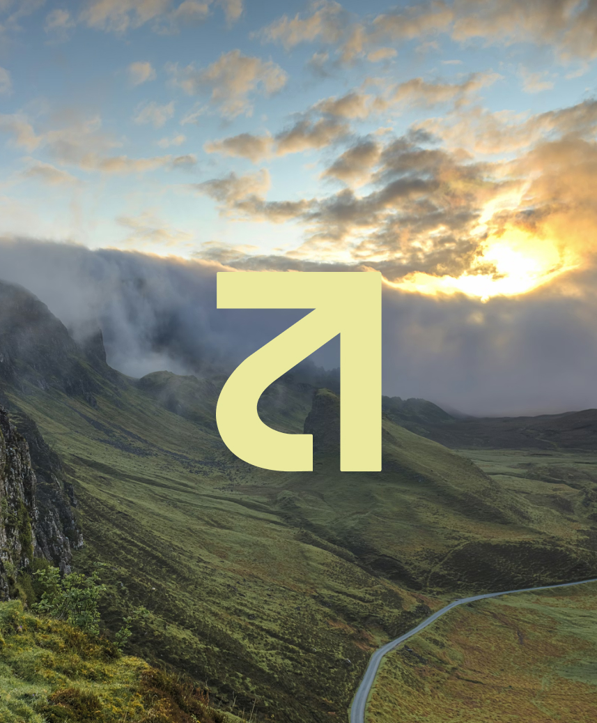 Rentabus brandmark over a mountain road at sunset