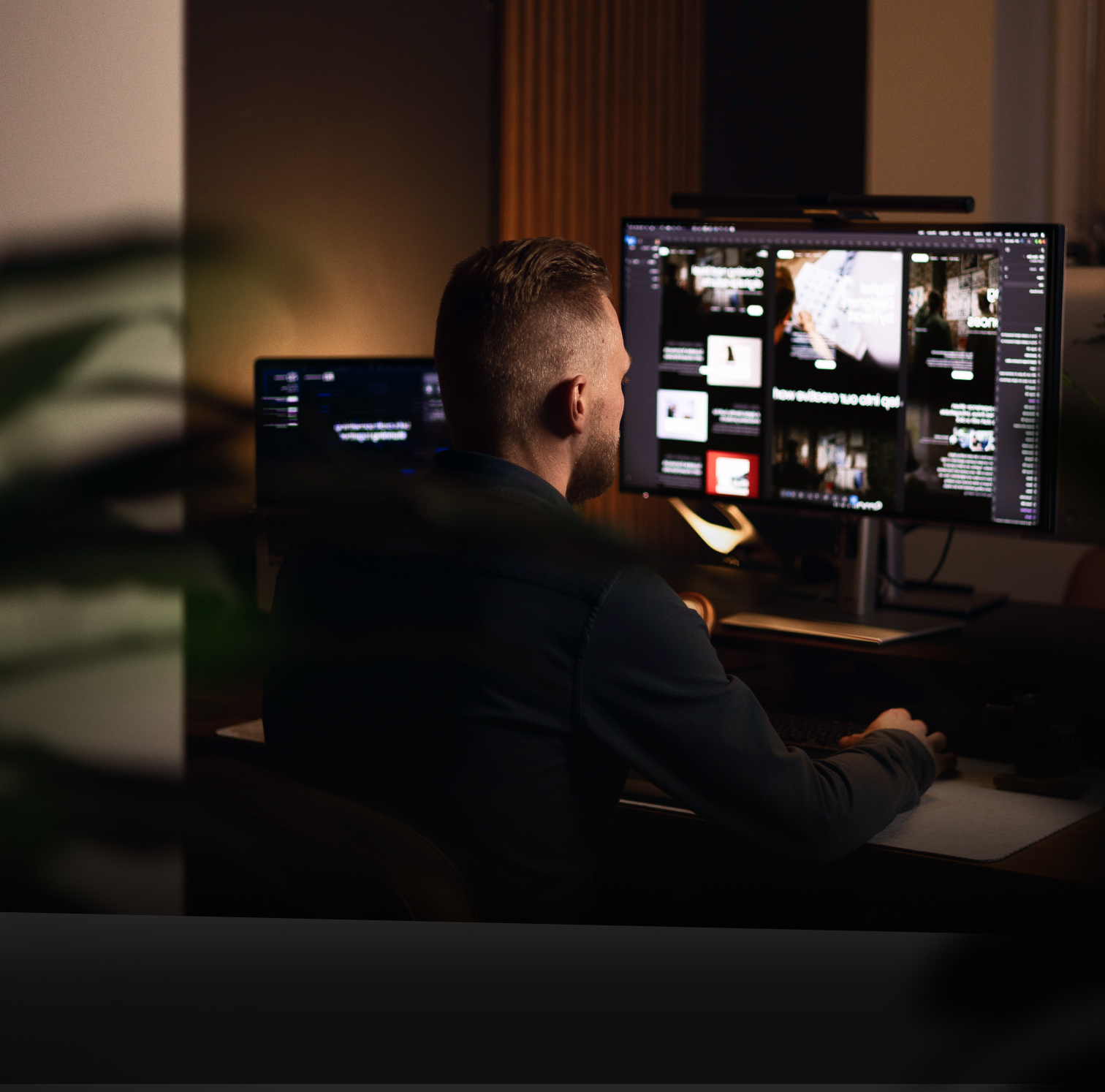 Digitalmakers workspace with a designer at a dual-monitor setup