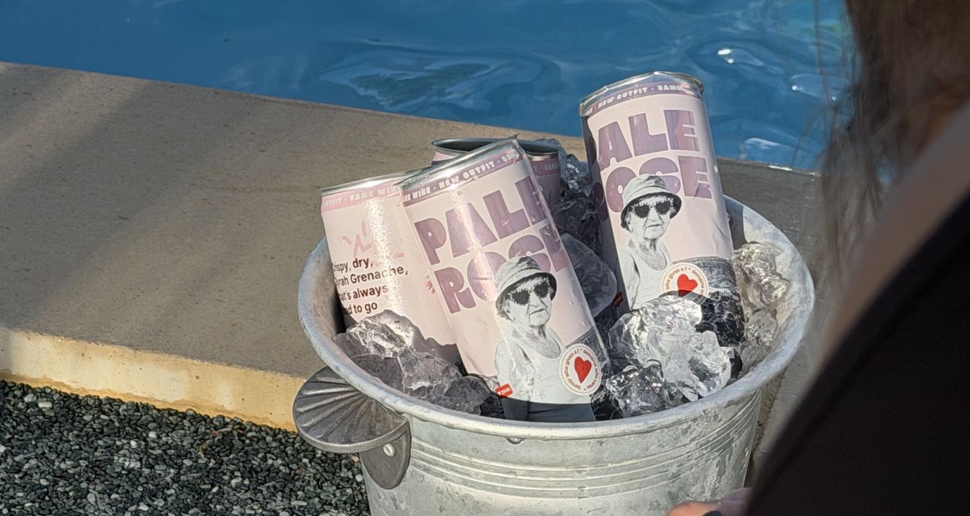 Bowi cans in a bucket of ice by the pool
