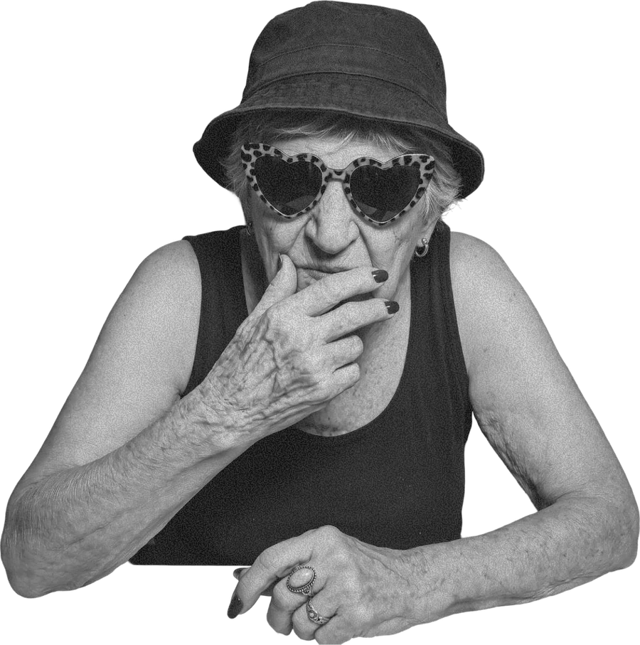 Cut-out black and white portrait of a grandmother in a bucket hat and heart-shaped sunglasses