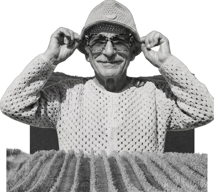 Cut-out grandfather in a crochet hat, pasted above a strip of vineyard