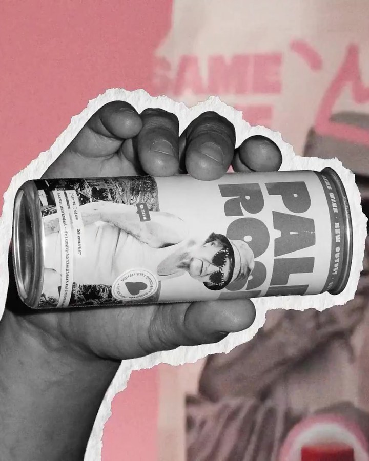 Frame from the brand film: a cut-out hand holds a Bowi can in front of the pouch, on pink