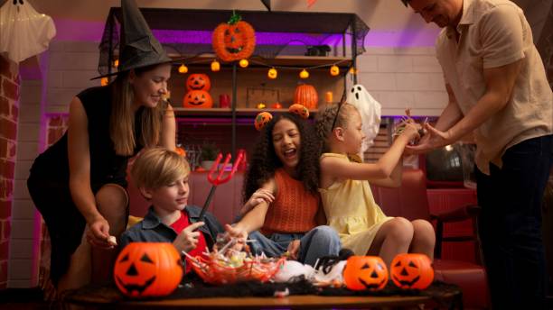 Parents and children are enjoying the halloween celebration party Parents and children are enjoying the halloween celebration party parent with kids halloween stock pictures, royalty-free photos & images