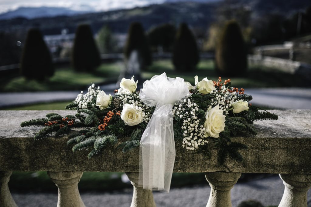 For winter weddings, use decorations and pops of colour to match the festive season