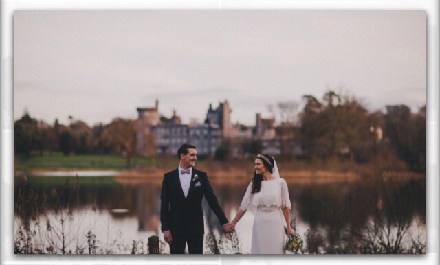 bride and groom outside Dromoland castle at their fairytale Irish wedding