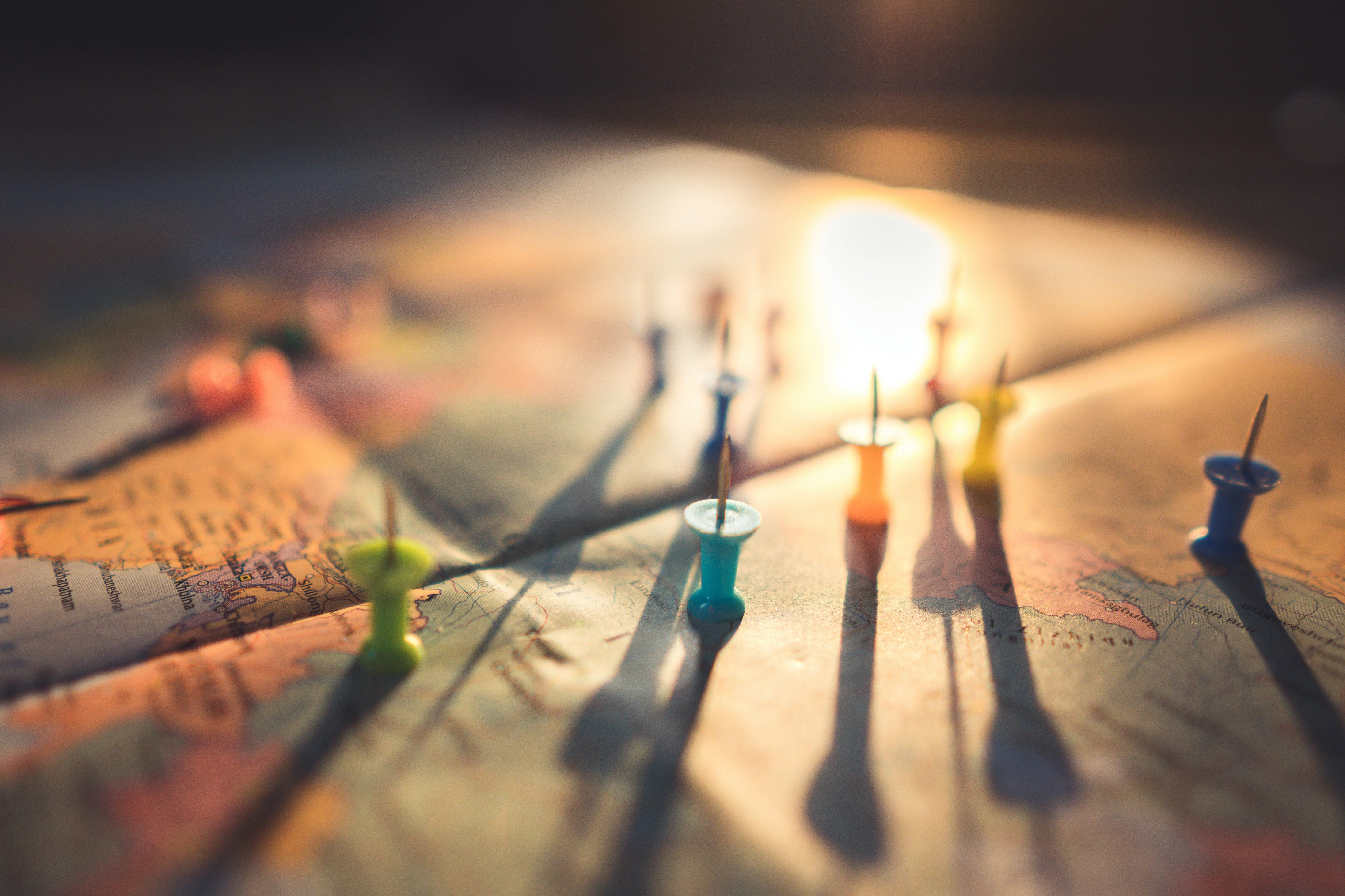 Thumb tacks on a map