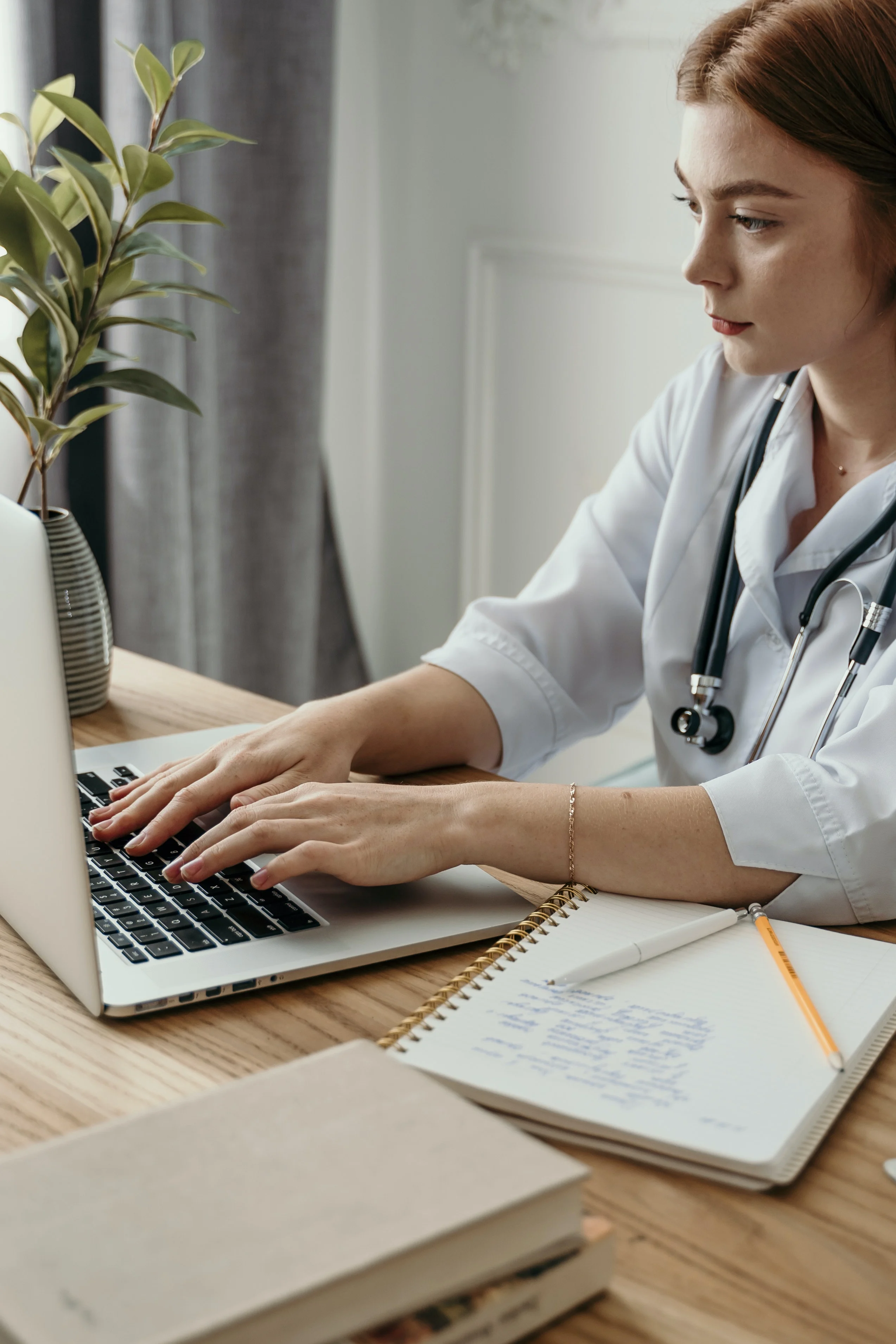 A doctor on a laptop