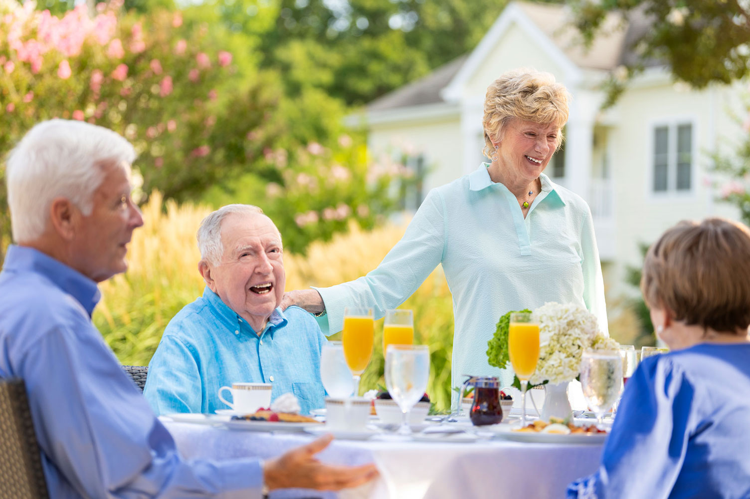 Residents dining outside on the veranda 