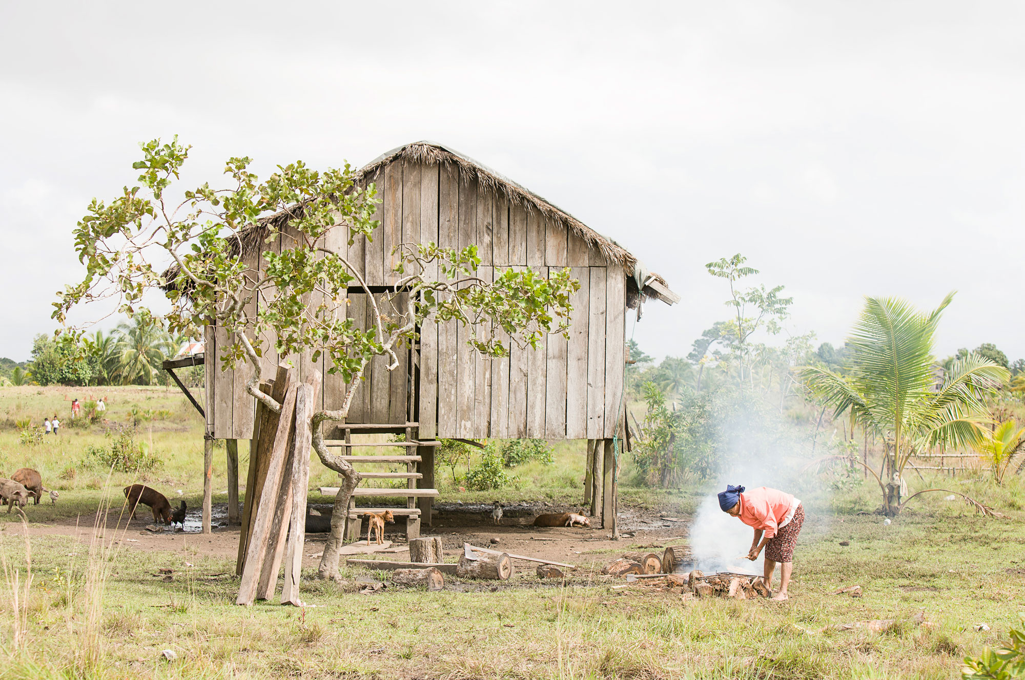 A woman tends a fire in a village in Honduras