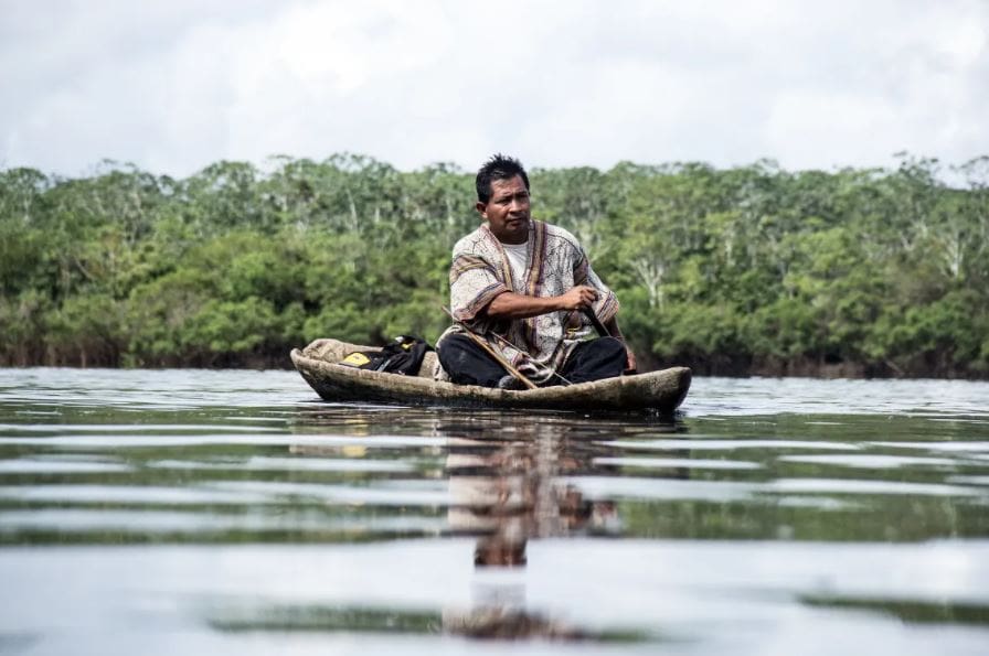A man paddles to catch his lunch on Peru’s Ucayali River; Juan Carlos Huayllapuma, CIFOR