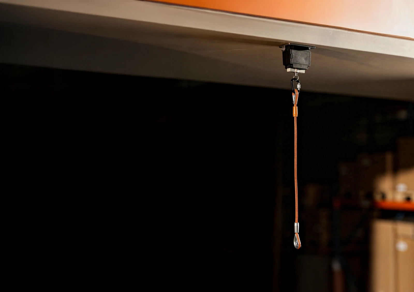 SMAVOO Order Cord pull line hanging from a ceiling mount above a warehouse aisle