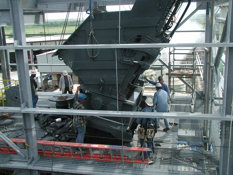 A group of men working on a large machine.