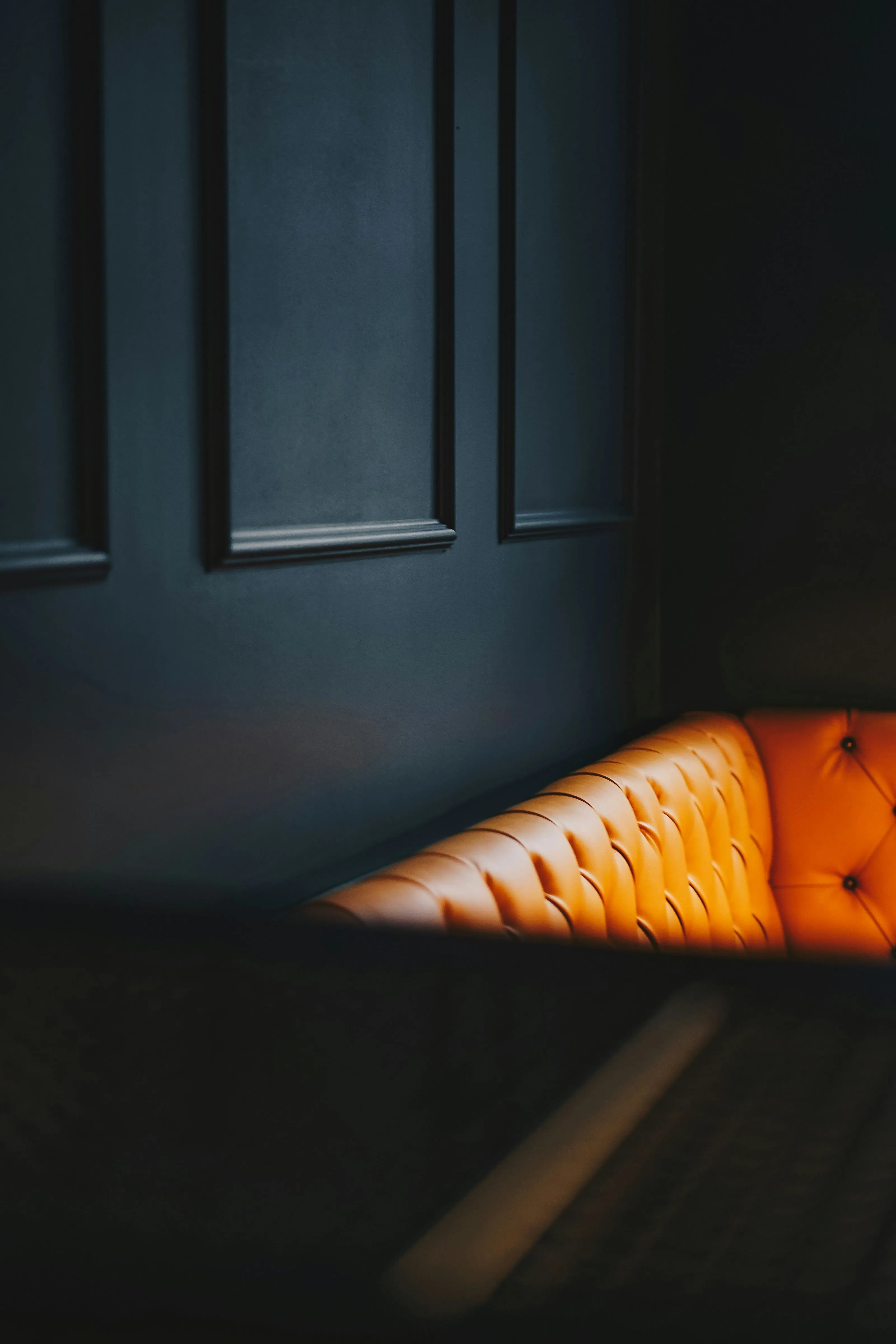 Orange sofa black background
