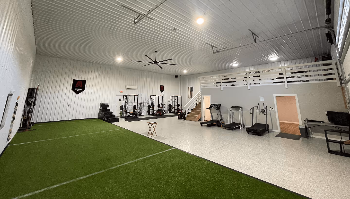Athlete HQ Full Gym with turf, workout equipment, speed, agility, weights, and office.