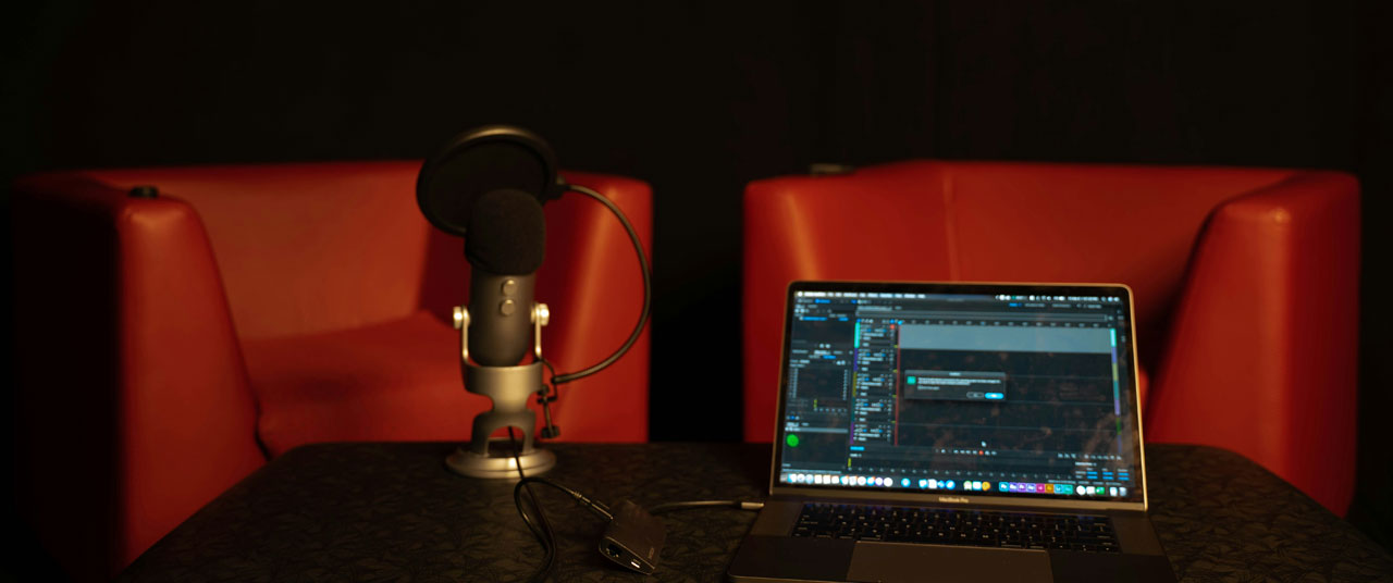 Two red chairs microphone meeting concept