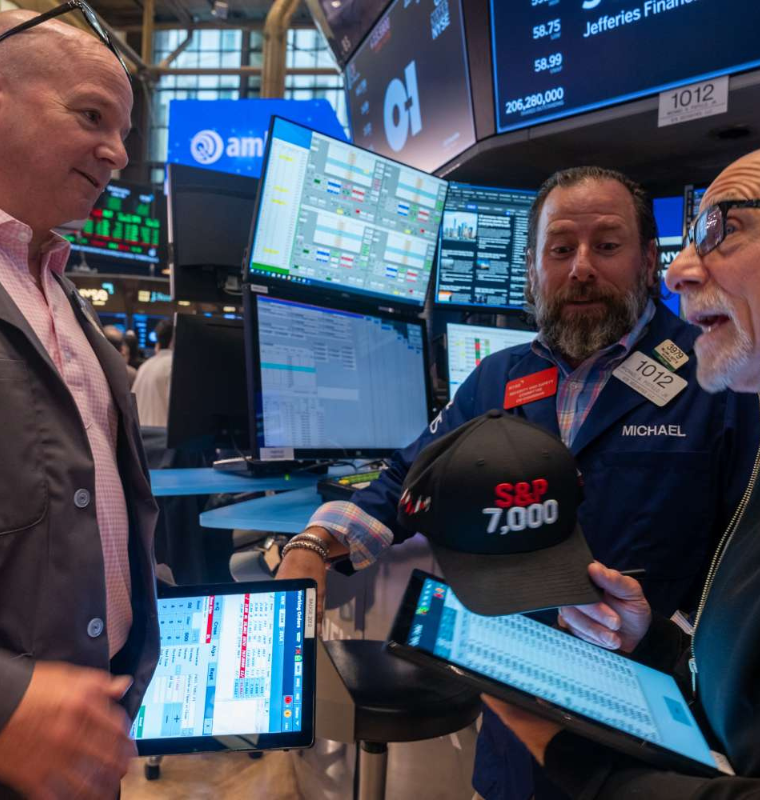 Wall Street Surges as All Three Major Indexes Close at Record Highs