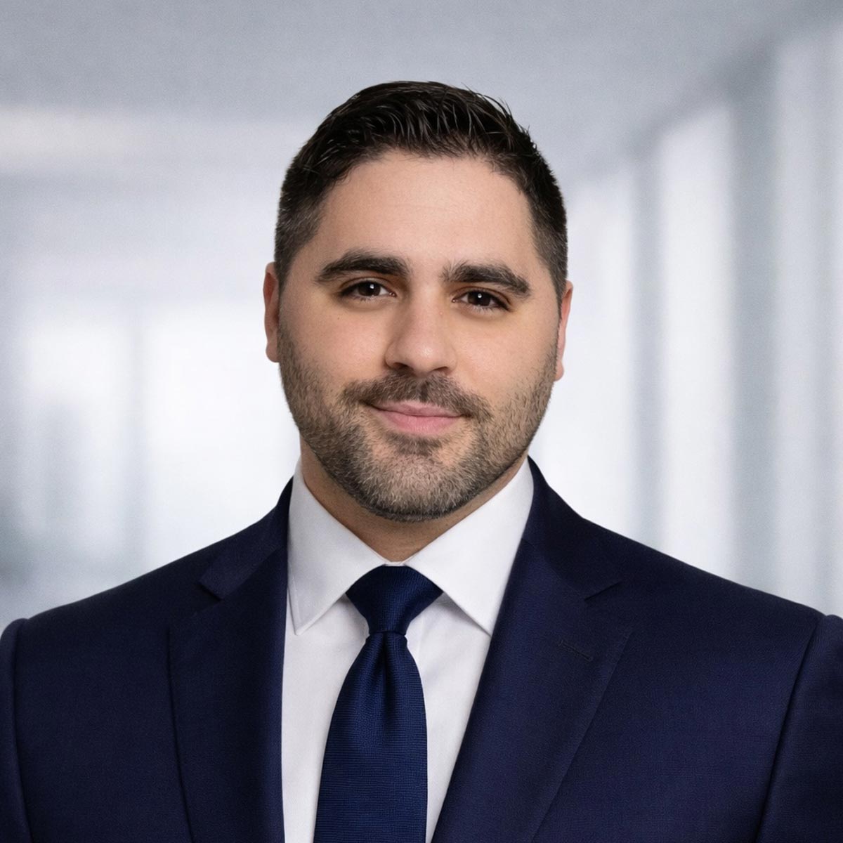 Professional headshot of Alex Matos