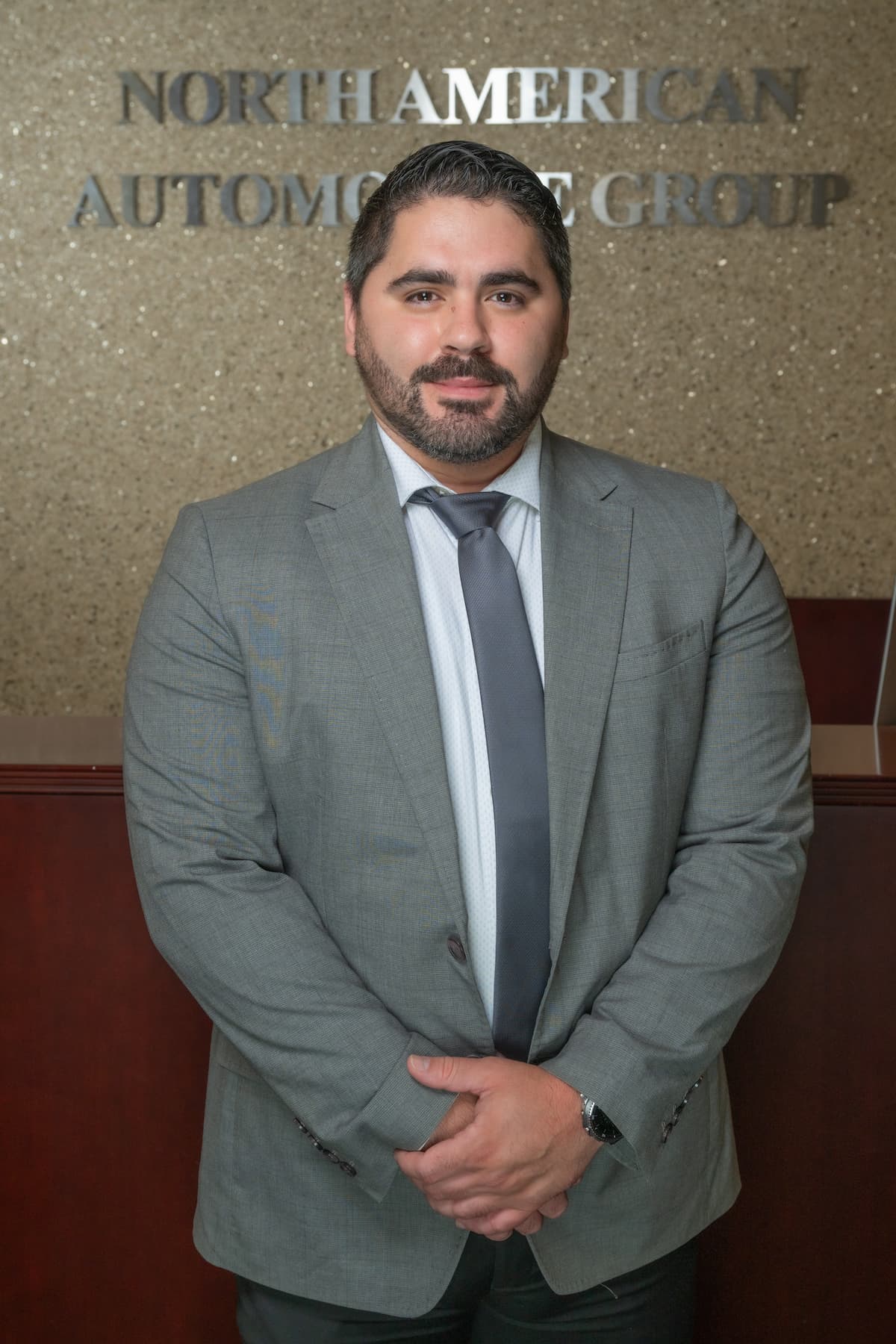 Professional headshot of Alex Matos