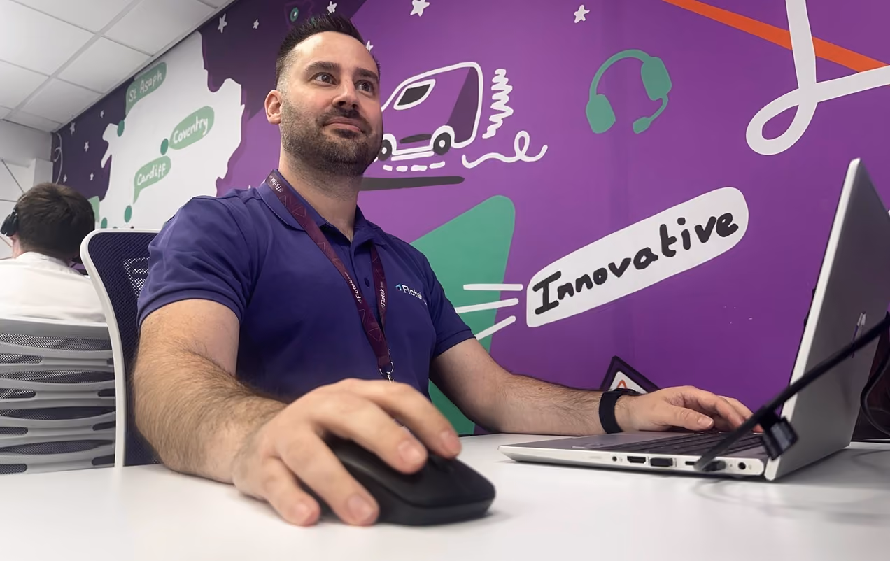 Flotek team member at his desk in the Flotek office, ready to help with your enquiry