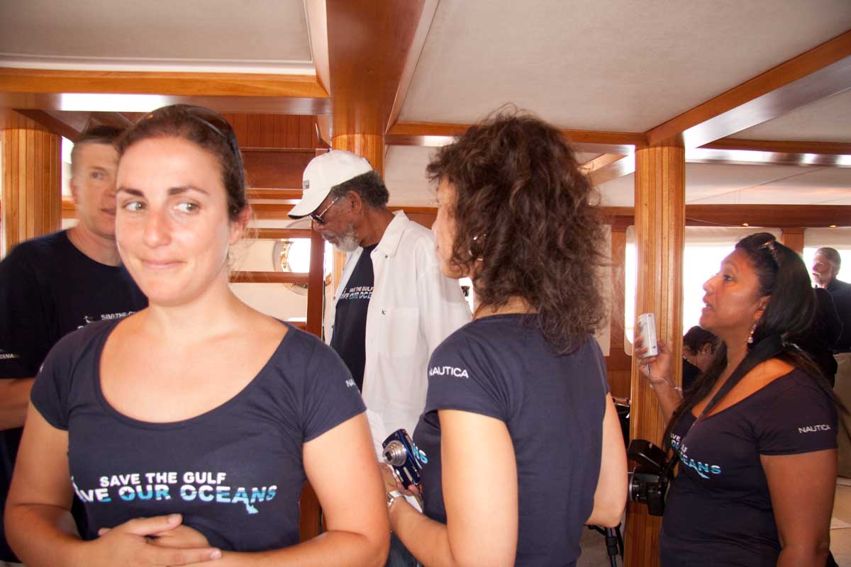 sole esnaola at an oceana event wearing a navy blue oceana shirt with Morgan Freeman behind her