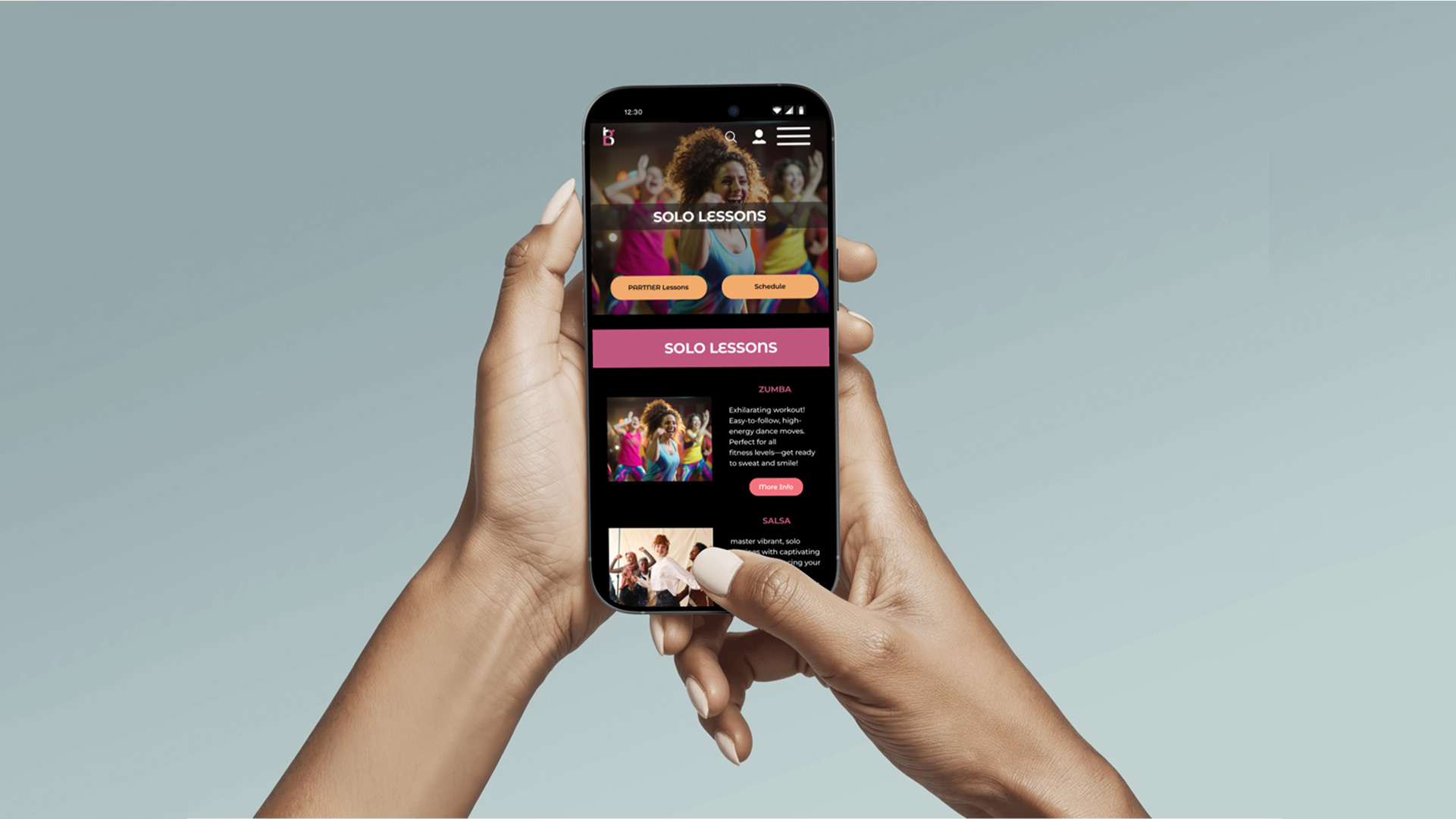 women hands holding cell phone with baza dance website re-design page open