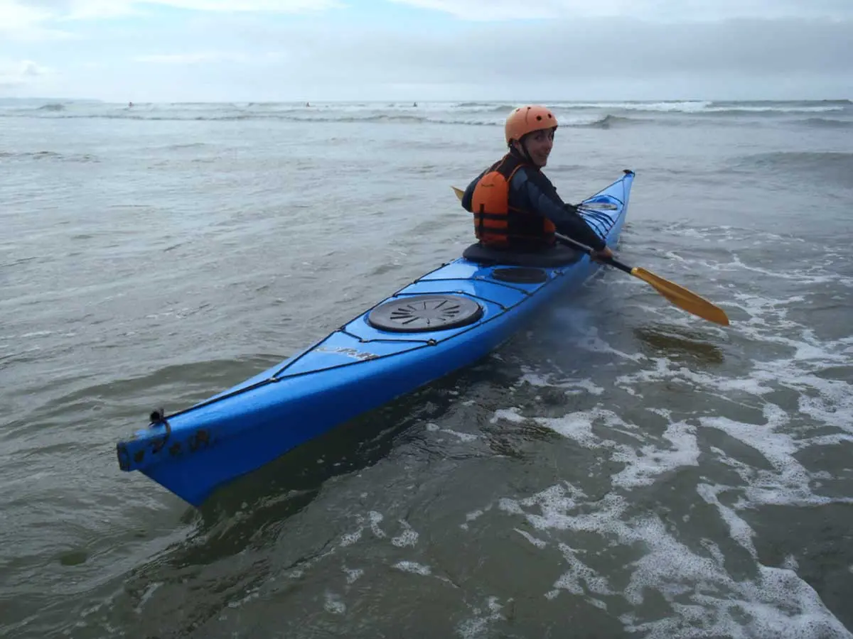 Sole Esnaola on a sea kayak about to go kayak surfing in Tofino about to go kayak surfing