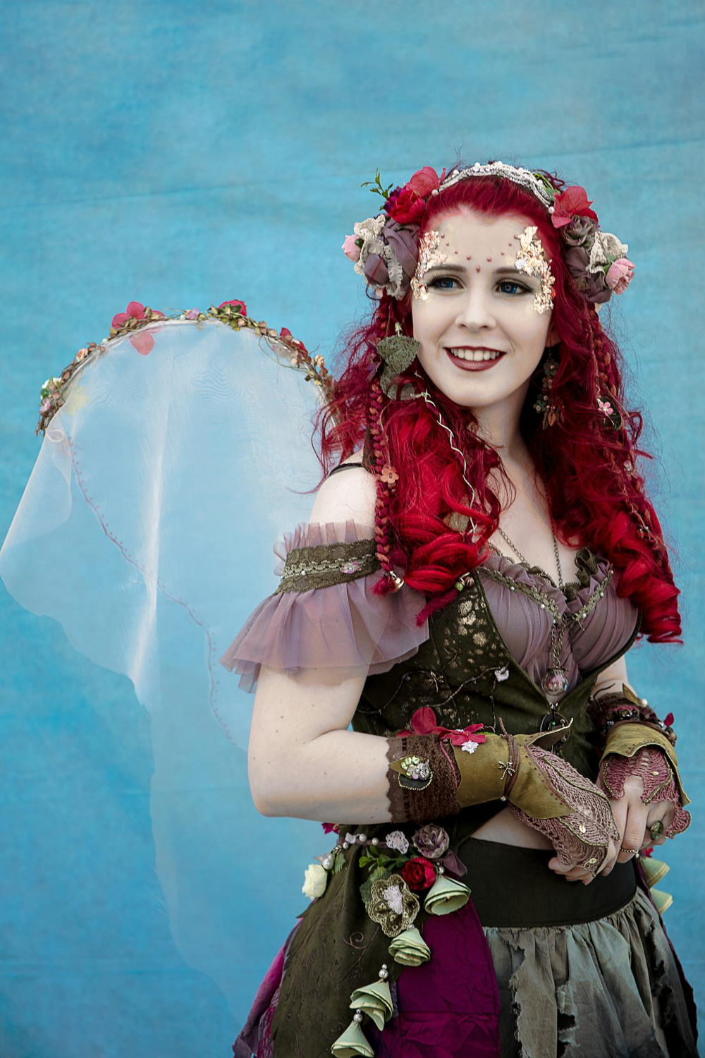 A woman wearing a fairytale steampunk costume.