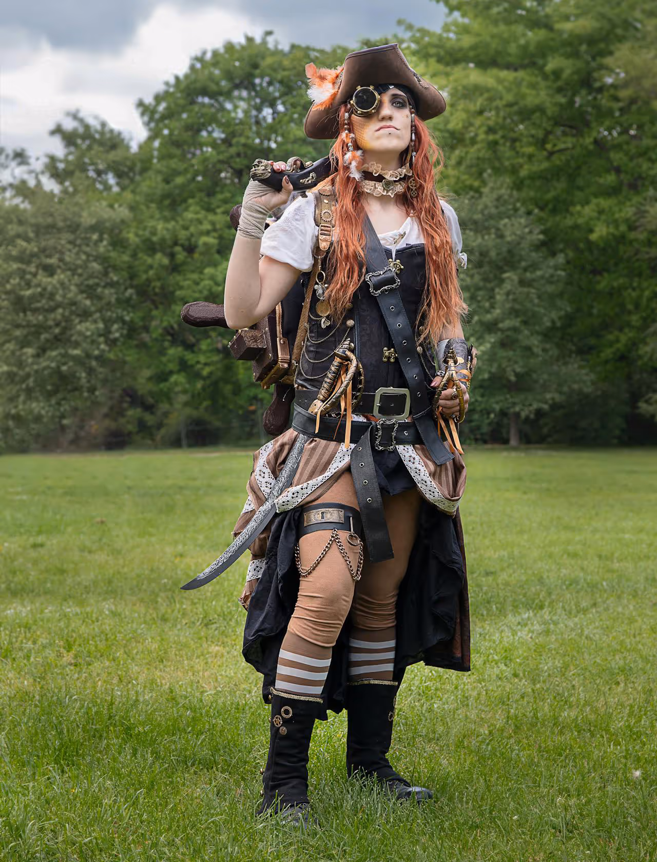 A woman wearing a steampunk costume with a pirate theme.