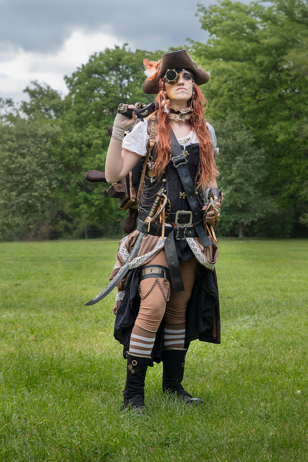 A woman wearing a steampunk costume with a pirate theme.