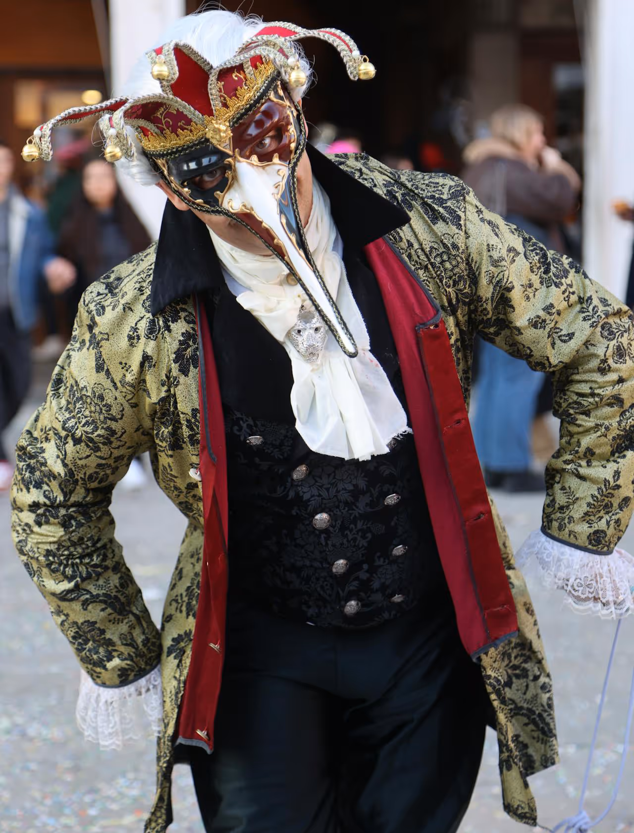 A man in a steampunk costume and a plaque mask