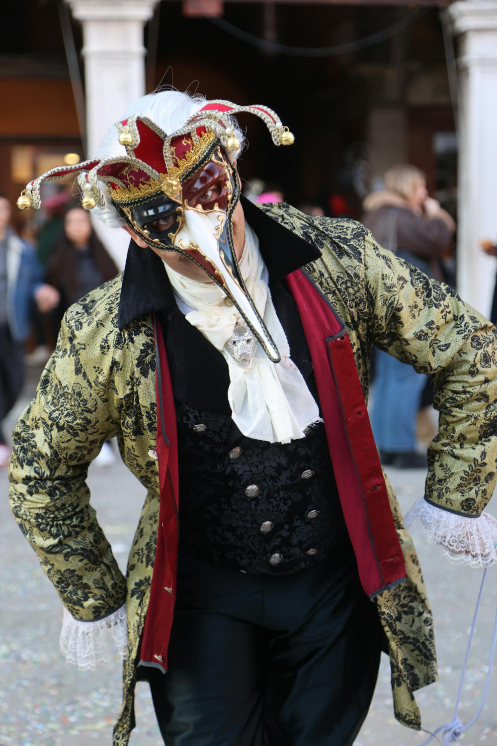 A man in a steampunk costume and a plaque mask