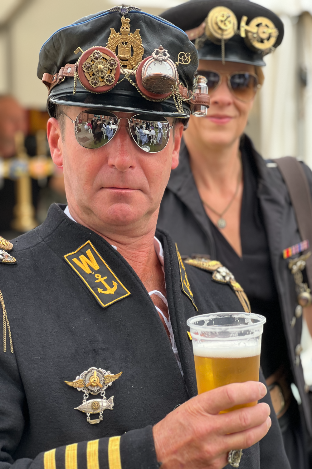 A man wearing an airline pilot steampunk costume