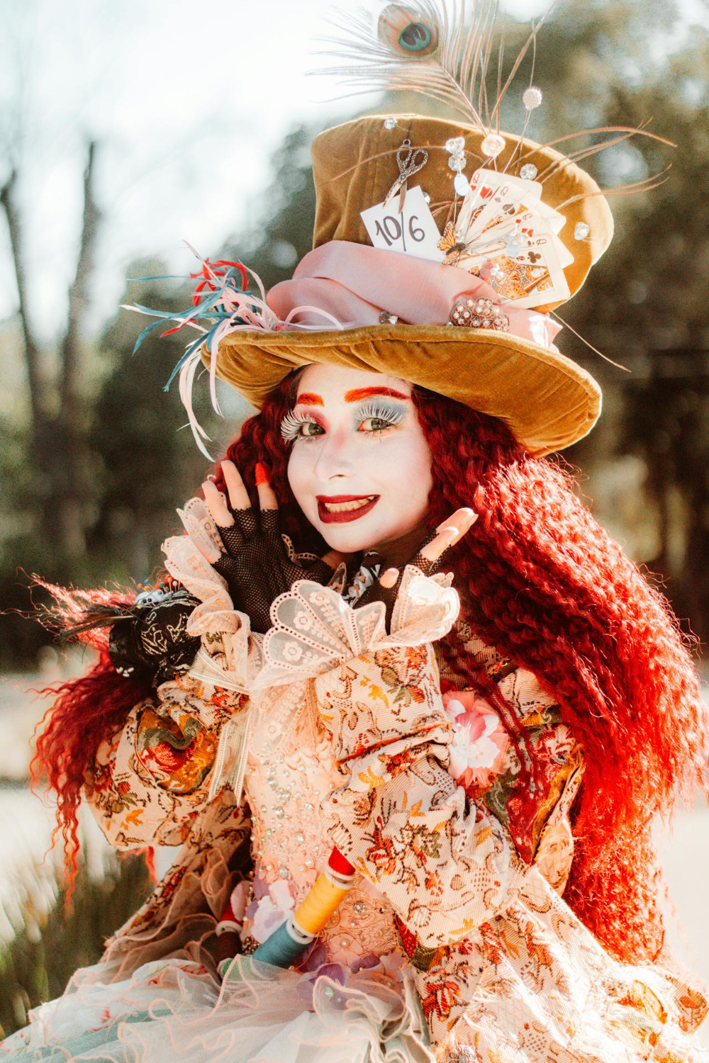 A girl in a steampunk mad hatter costume